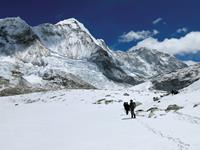 Trekking the snowy fields back towards Ghunsa on the Great Himalaya Trail, Nepal.